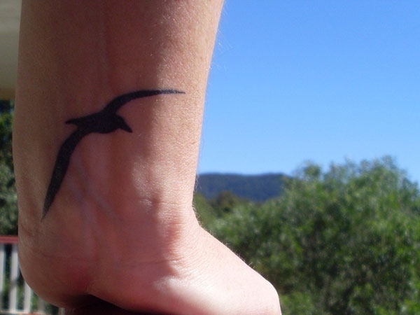 Silhouette Flying Seagull Tattoo On Wrist