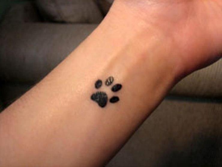 Silhouette Leopard Paw Print Tattoo Design For Wrist