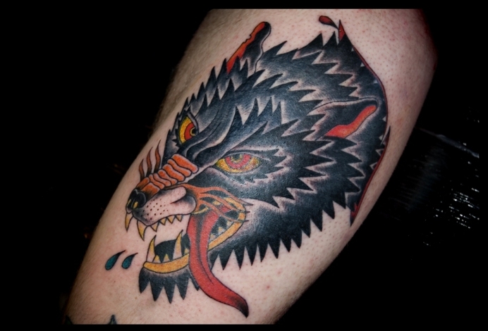 Traditional Wolf Head Tattoo On Bicep