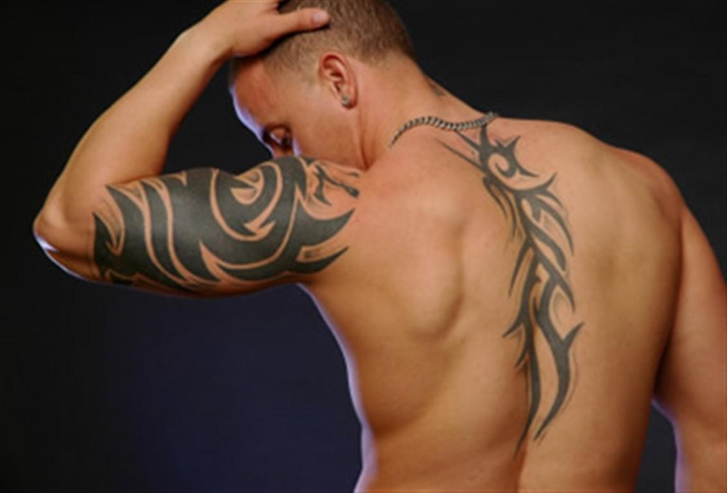 Tribal Tattoo On Back And Left Sleeve