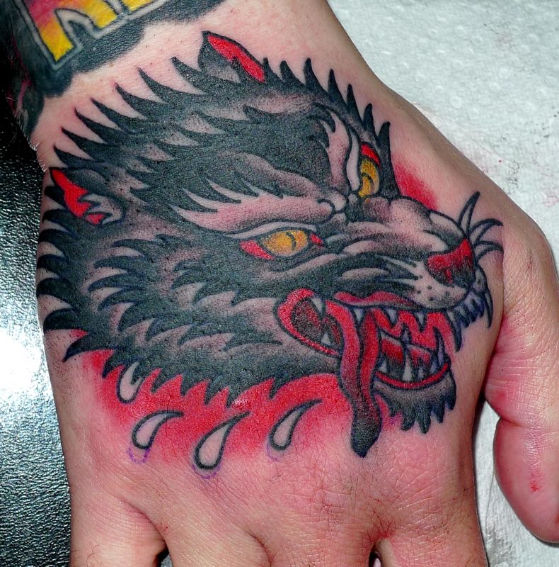 Yellow Eyes Traditional Wolf Tattoo On Right Hand by Stewart Robson