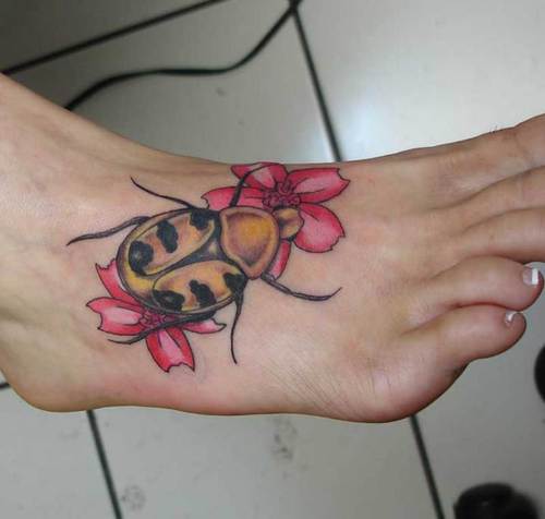 Amazing Beetle With Flowers Tattoo On Girl Foot