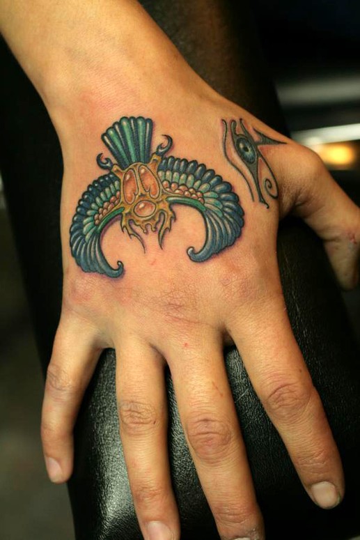 Awesome Beetle With Horus Eye Tattoo On Hand