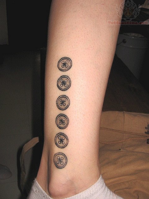 Black And Grey Six Buttons Tattoo On Leg By Kinikkin Reims