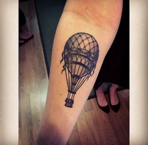 Black Ink Hot Air Balloon Tattoo On Forearm