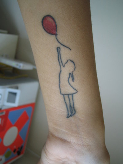 Black Outline Banksy Girl With Balloon Tattoo On Wrist