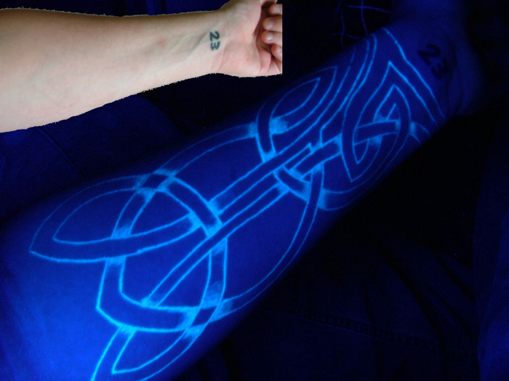 Blacklight Celtic Design Tattoo On Forearm