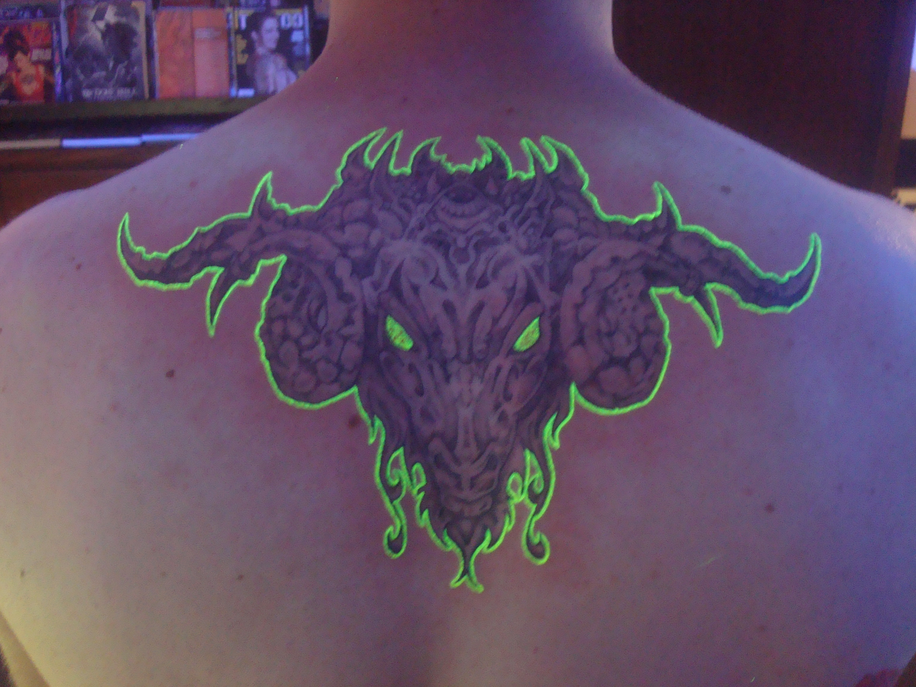 Blacklight Goat Head Tattoo On Upper Back