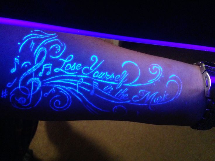 Blacklight Lost Yourself In The Music - Violin Key With Music Knots Tattoo On Forearm