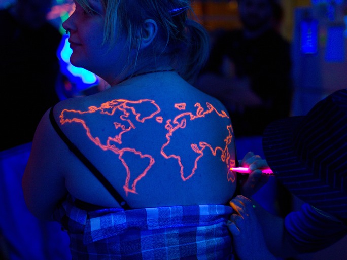 Blacklight Outline World Map Tattoo On Girl Upper Back