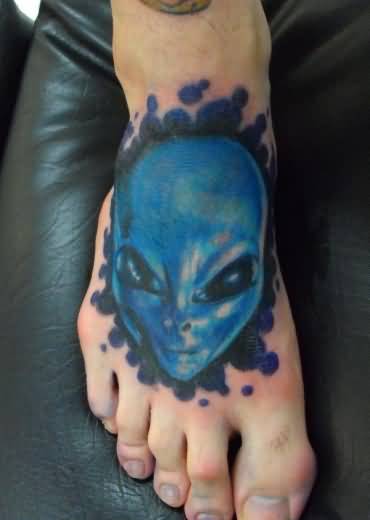 Blue Ink Alien Head Tattoo On  Right Foot