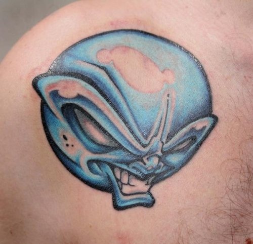 Blue Ink Alien Head Tattoo On Shoulder