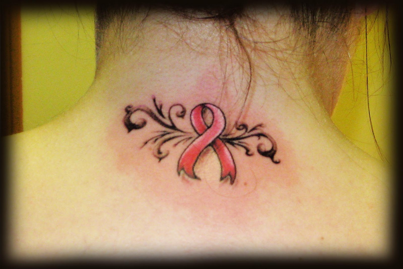 Breast Cancer Logo With Swirl Tattoo On Back Neck