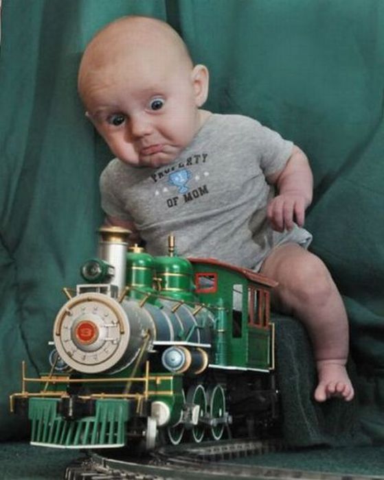 Child On Toy Train Funny Picture