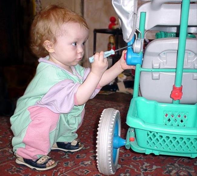 Child Trying To Open Perambulator Funny Image