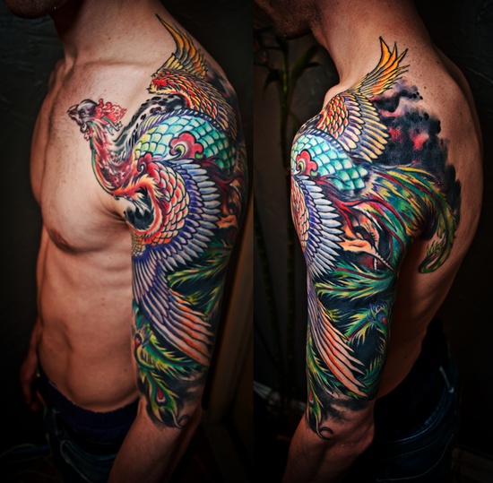 Colorful Asian Peacock Tattoo On Man Left Half Sleeve