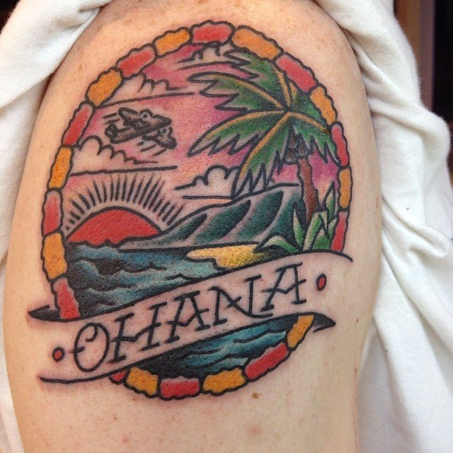 Colorful Beach Scene In Frame With Banner Tattoo On Shoulder