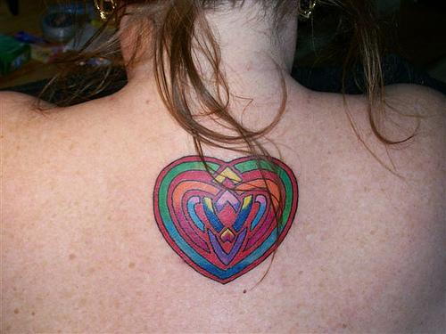 Colorful Celtic Knot Love Tattoo On Upper Back