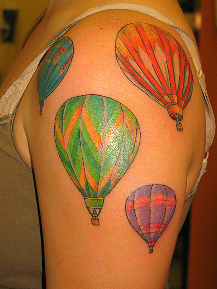 Colorful Four Hot Air Balloon Tattoo On Girl Left Shoulder
