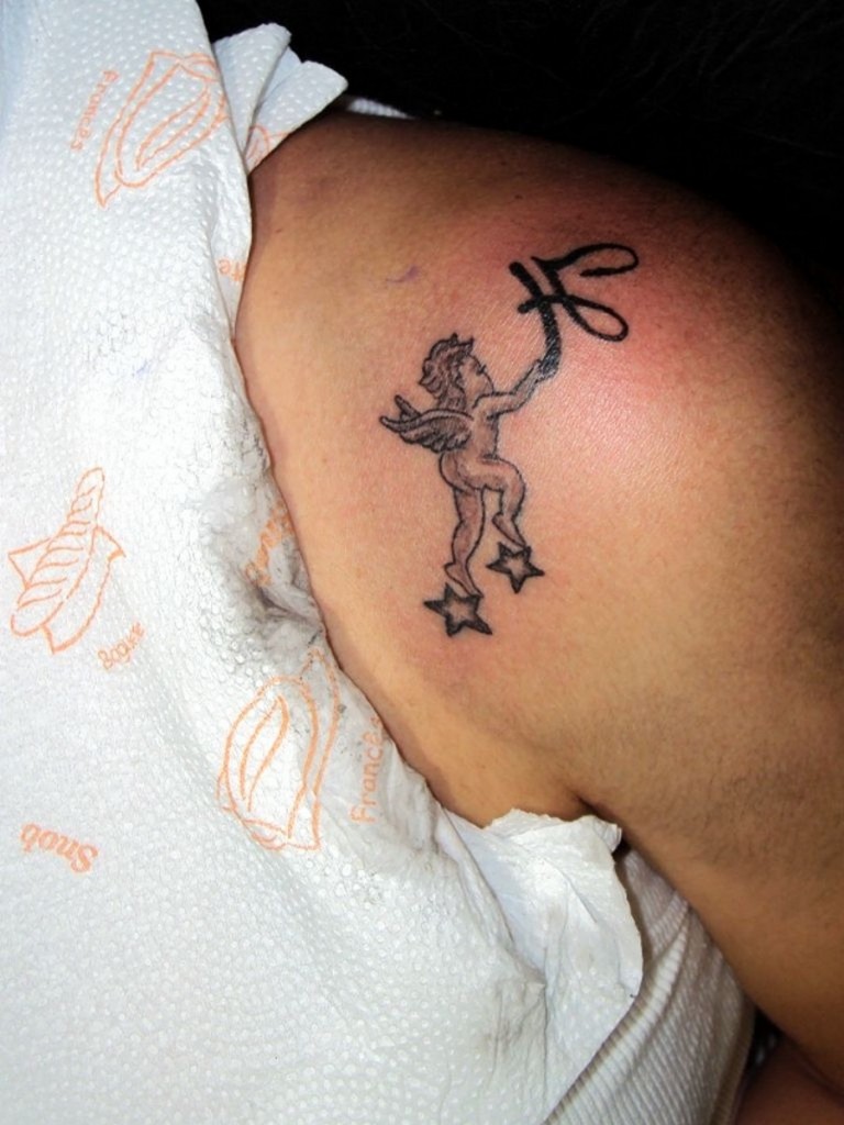 Cute Small Baby Angel Tattoo on Knee