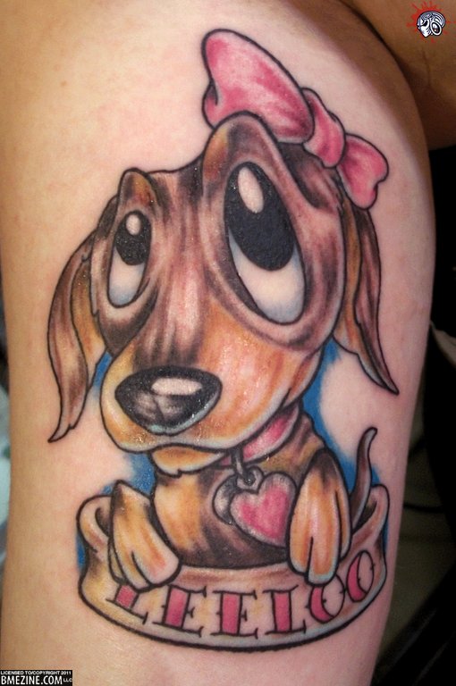 Cute cartoon puppy tattoo on bicep
