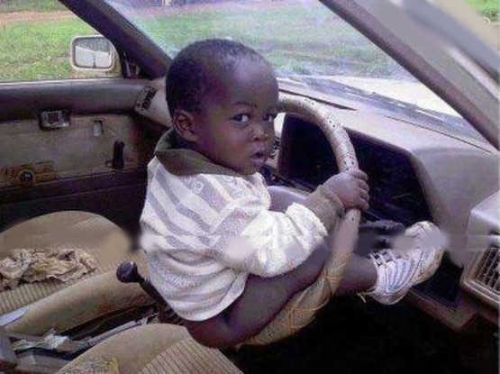 Funny African Child On Steering Wheel