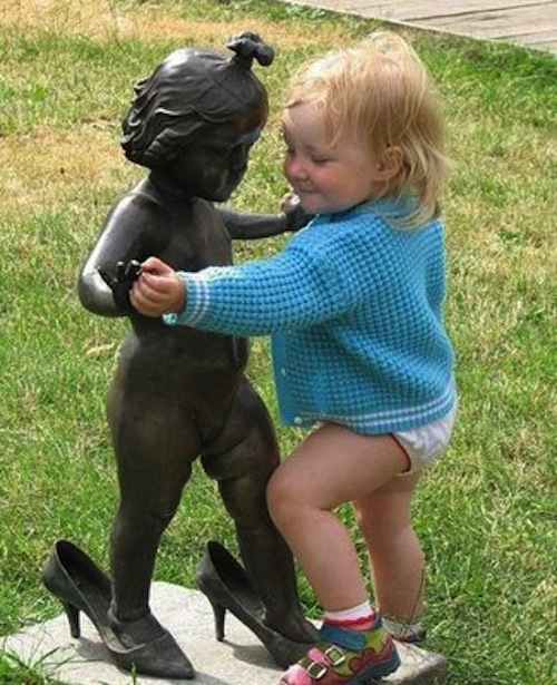 Girl Child Dancing With Statute Funny Image