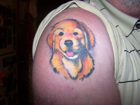 Golden retriever puppy tattoo on shoulder
