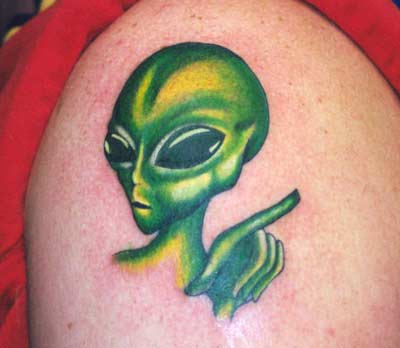 Green Alien Head Tattoo On Shoulder