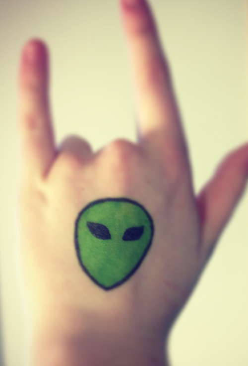 Green Ink Alien Head With Black Eyes