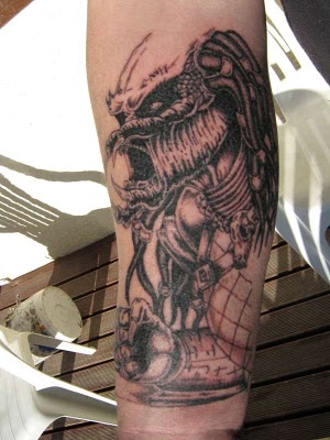 Grey Alien Tattoo On Arm Sleeve
