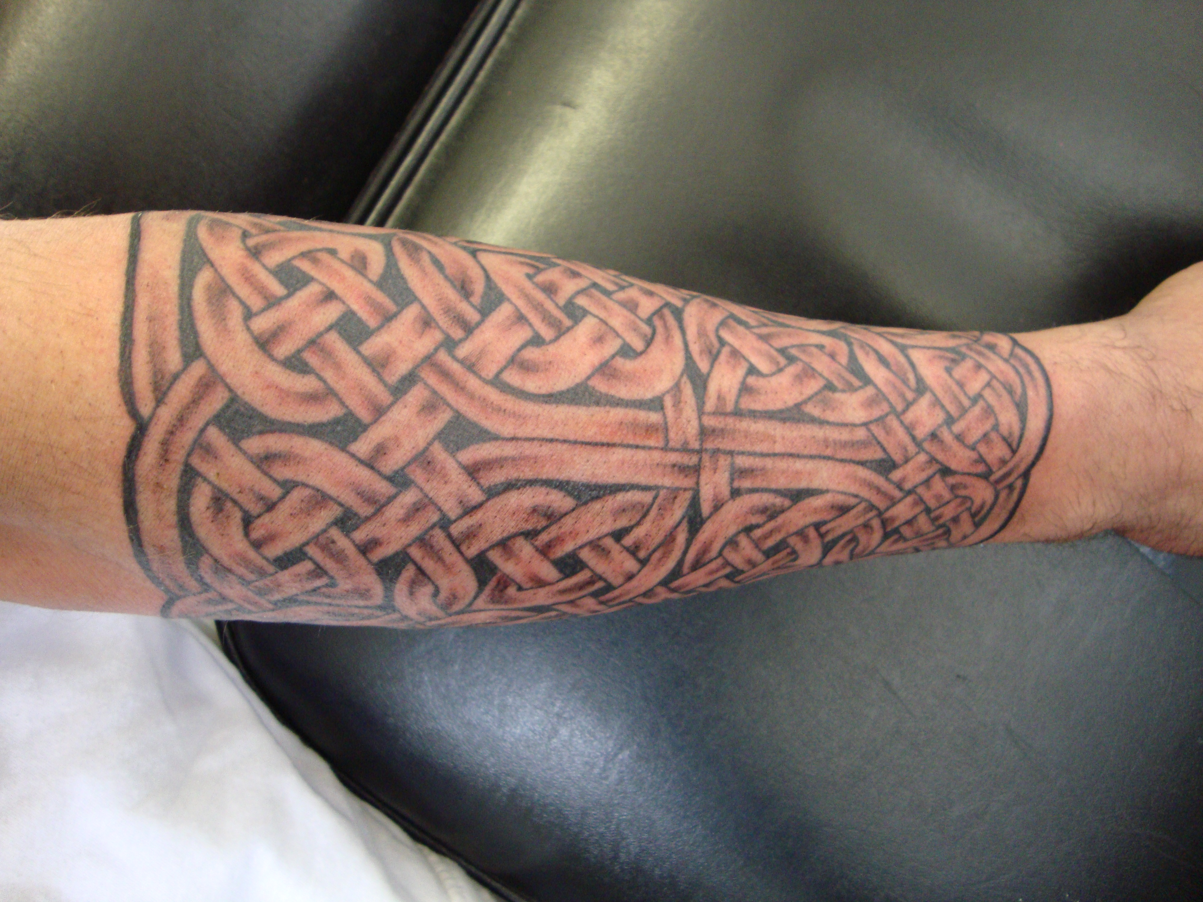 Grey Celtic Knot Tattoo On Arm Sleeve