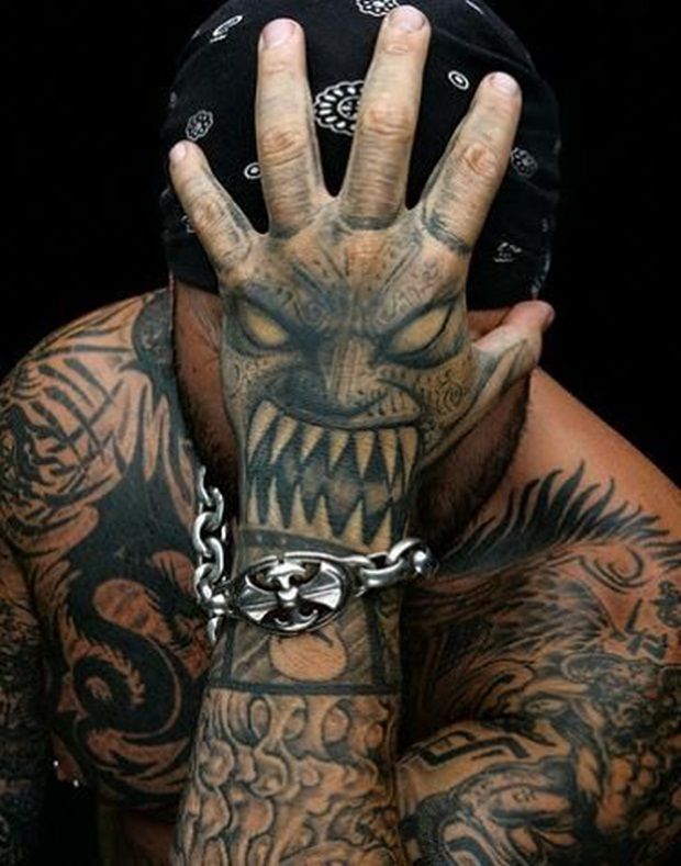 Illusion Black Ink Asian Devil Face Tattoo On Hand