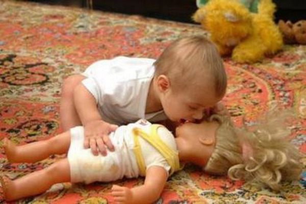 Kid Kissing Doll Funny Picture