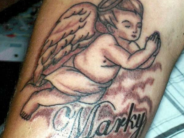 Marky Flying Baby Angel Tattoo On Bicep