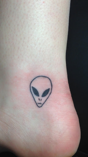 Nice Alien Head Tattoo On Heel