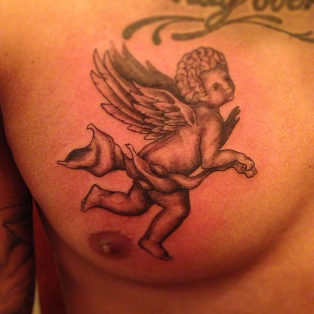 Nice Grey Ink Flying Baby Angel Tattoo On Chest For Men