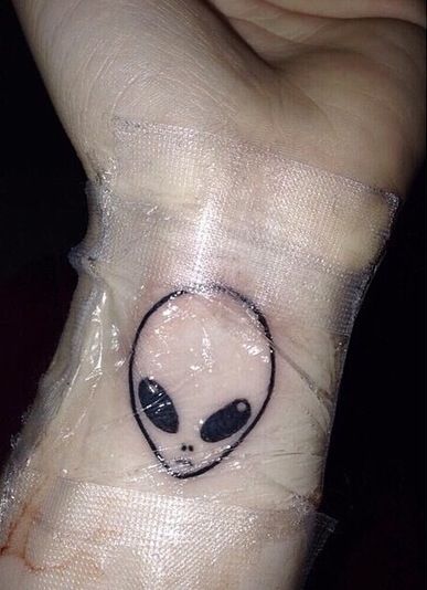 Outline Alien Head Tattoo On Wrist