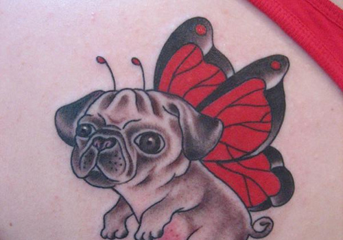 Puppy with red butterfly wings tattoo