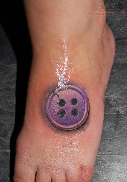 Purple Ink Button Tattoo On Foot