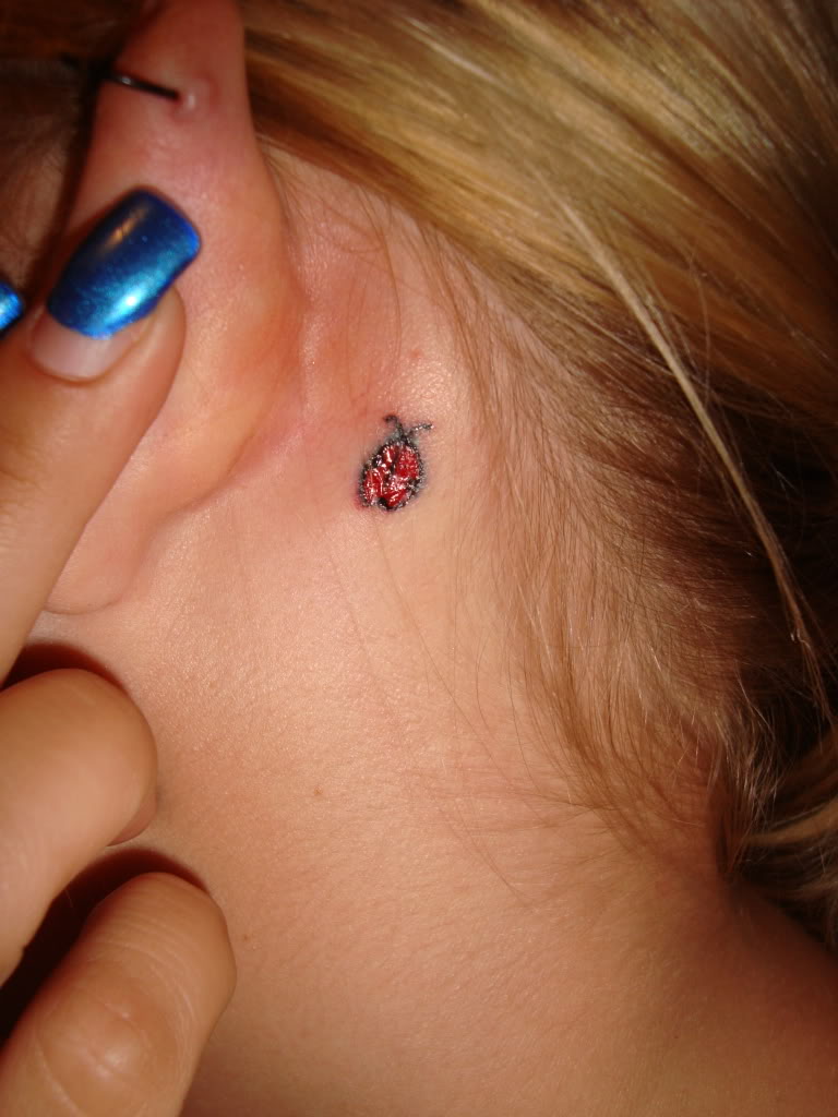 Red Ink Bug Tattoo Tattoo On Girl Behind The Ear