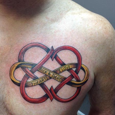 Red Ink Celtic Love Tattoo On Chest For Men