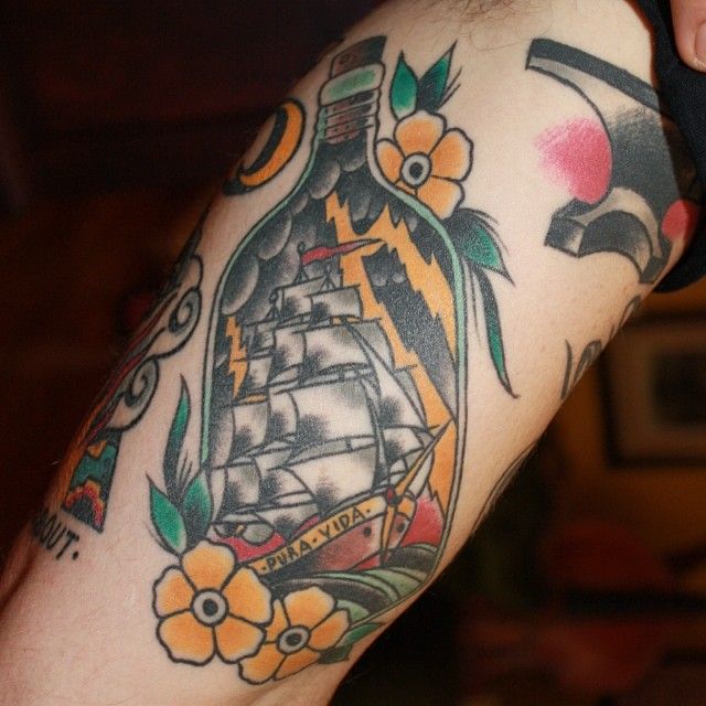 Ship In Bottle With Flowers Tattoo Design For Sleeve