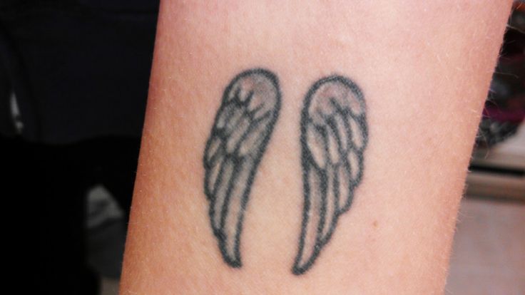 Small Angel Wings Tattoo on Arm
