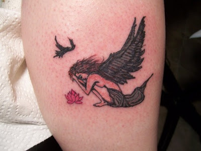 Small crying fallen angel tattoo