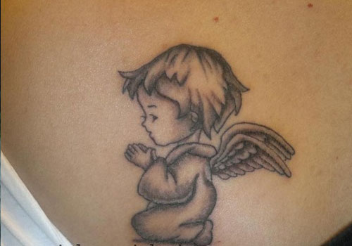 Small praying baby angel tattoo