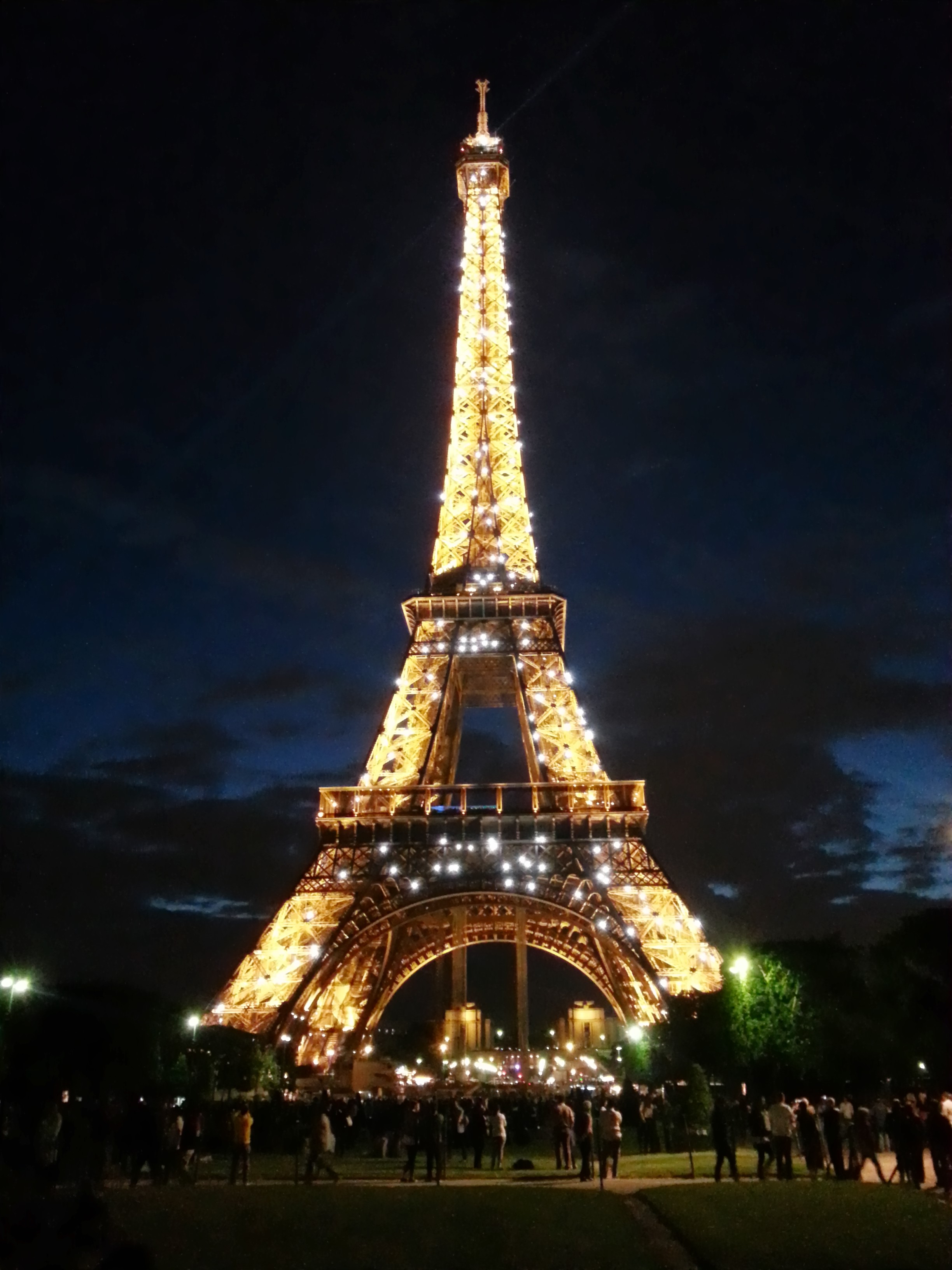 Sparkling Eiffel Tower at night from distance