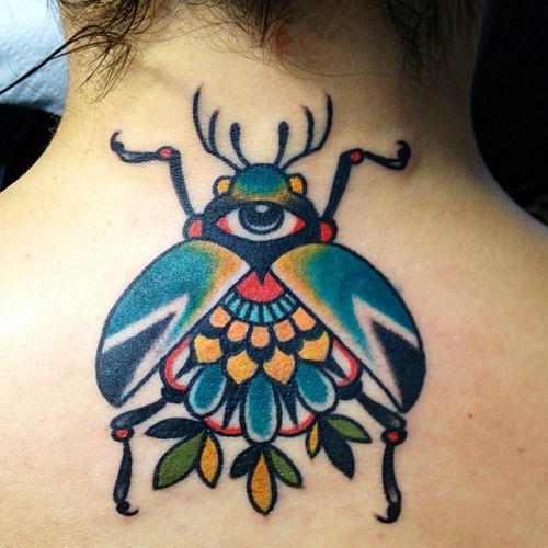 Traditional Beetle Tattoo On Girl Back Neck