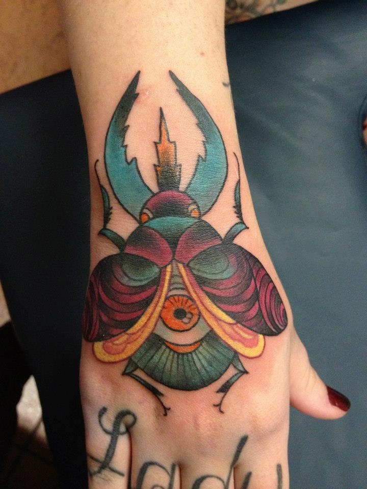 Traditional Colorful Beetle Tattoo On Hand By Marcella Rangel