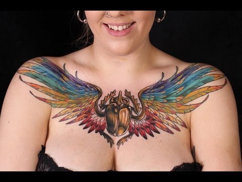 Unique Colorful Beetle Tattoo On Girl Chest